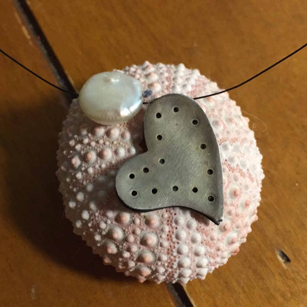 Pearl and silver charm necklace